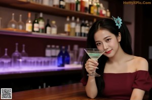 A naked asian woman sitting on the floor next to a table.