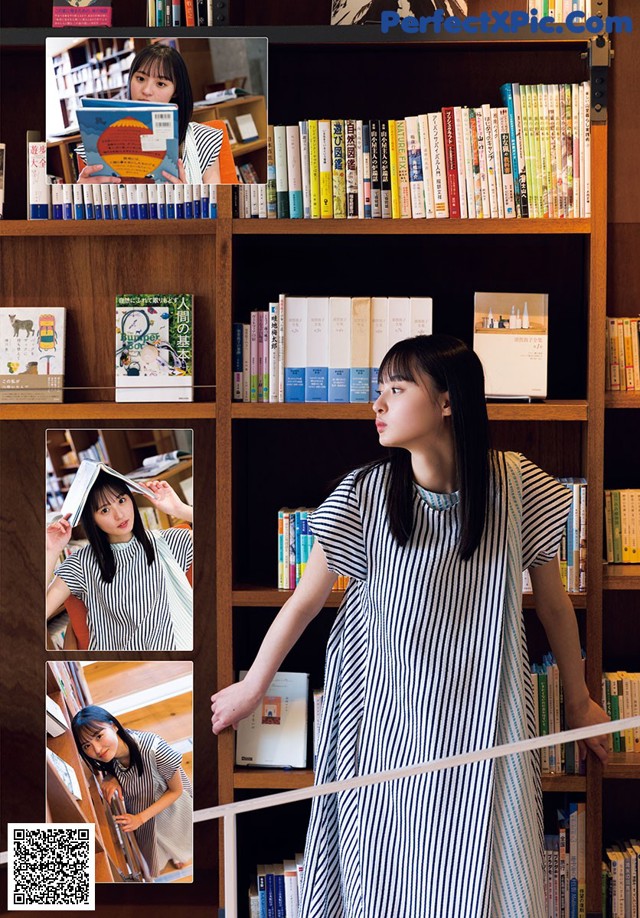 A woman standing in front of a bookshelf holding a book.