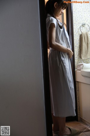 A woman is washing her hands with soap bubbles.