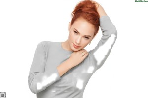 A woman in a black and white bra posing for a picture.