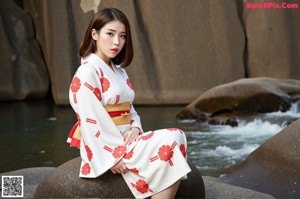 A woman in a white dress posing for a picture.